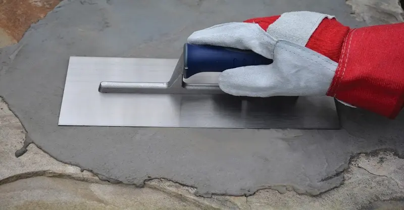 They are smoothing with a trowel