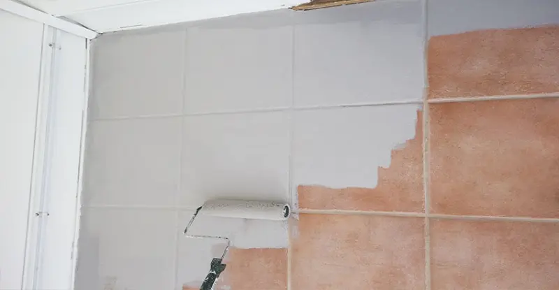 Painting ceramic tiles with a brush