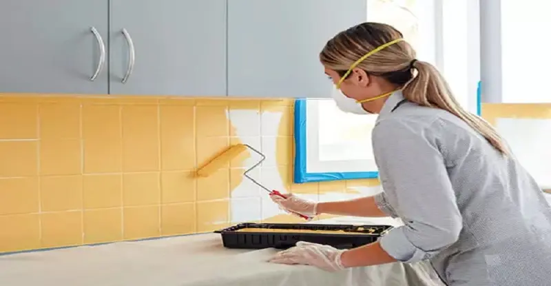 Someone is painting the tiles